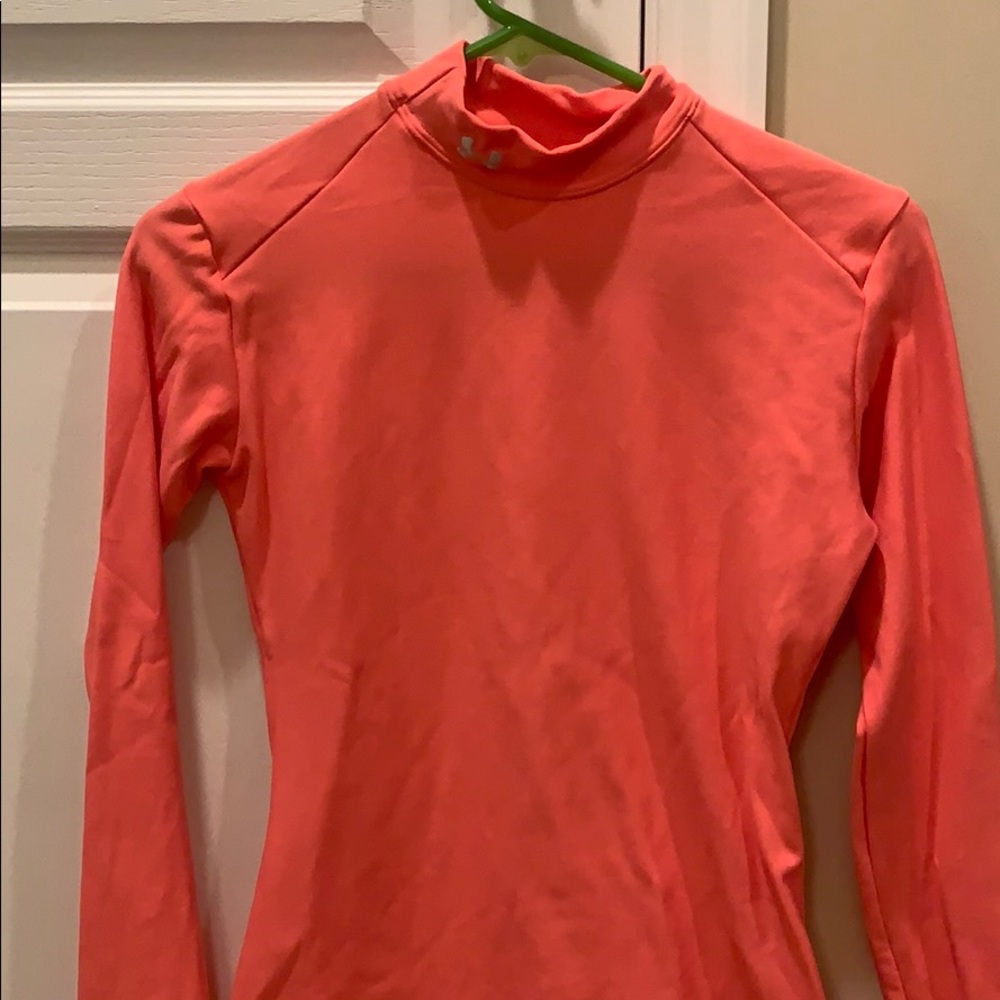 Coral pink long sleeve Under Armour thermal shirt.